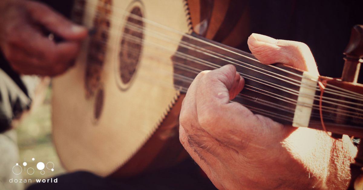 Hands playing an oud, representing the Arabic maqam system and 8 core maqamat for beginners